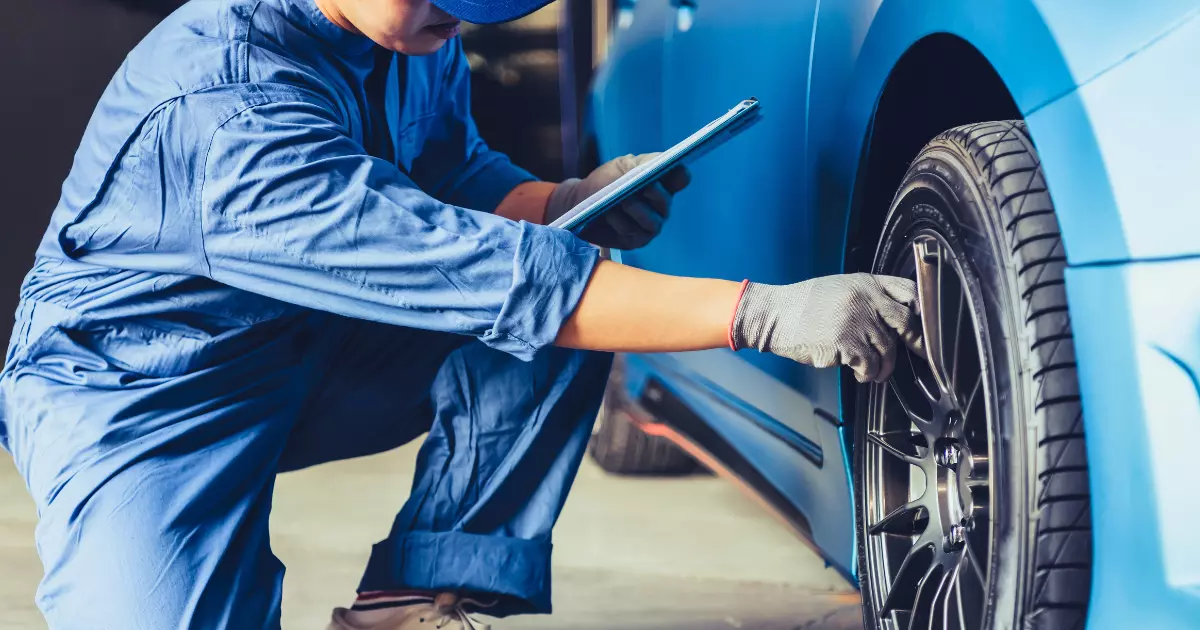 fleet manager checking the tire